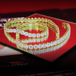 Gold and diamond choker on a red background