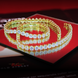 Gold and diamond choker on a red background